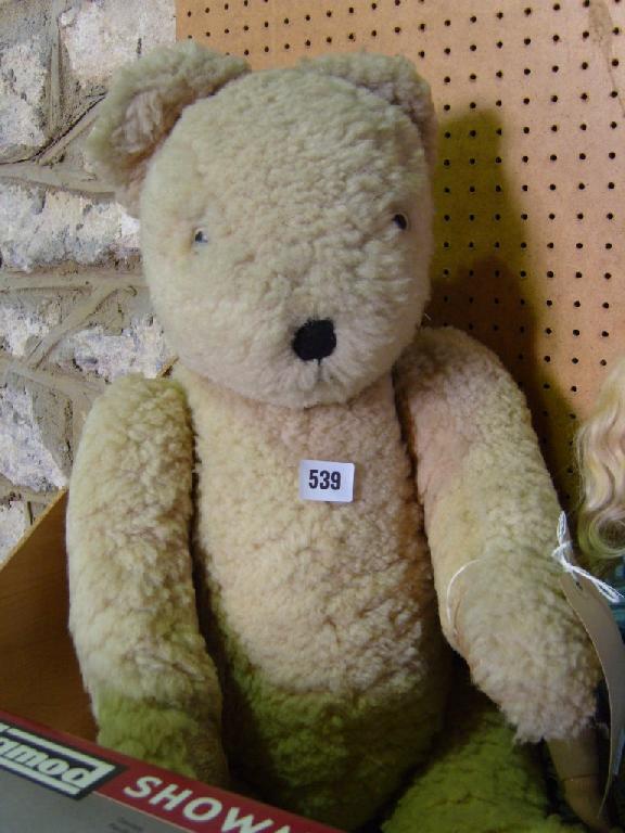 Appraisal: A large teddy bear with cream coloured wool finish -