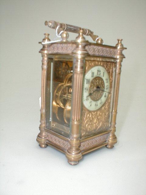 Appraisal: A French gilt brass carriage timepiece the enamelled two part