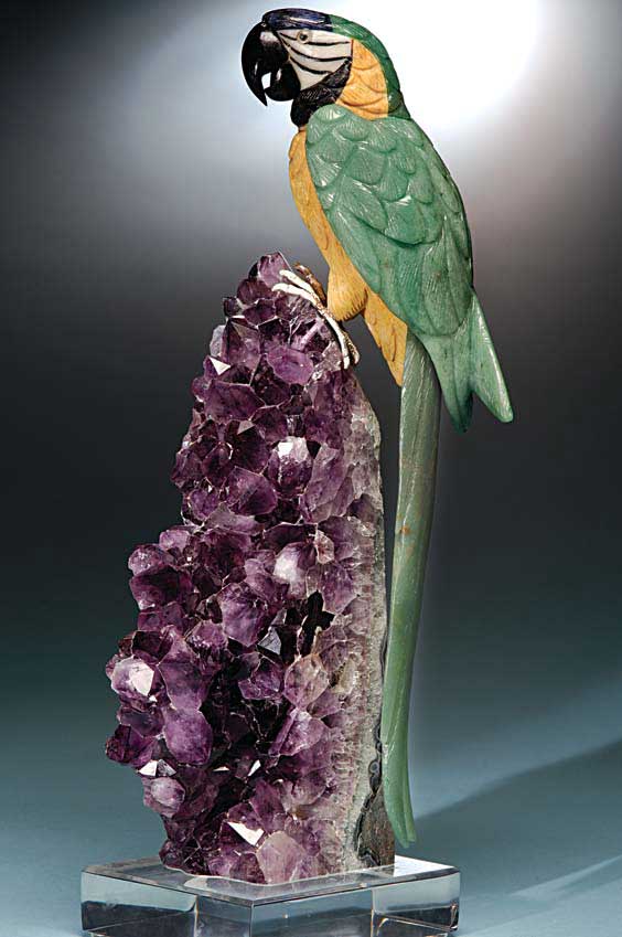 Appraisal: MULTI-COLORED MACAW PERCHED ON AMETHYST Artist Peter Muller Brazil A