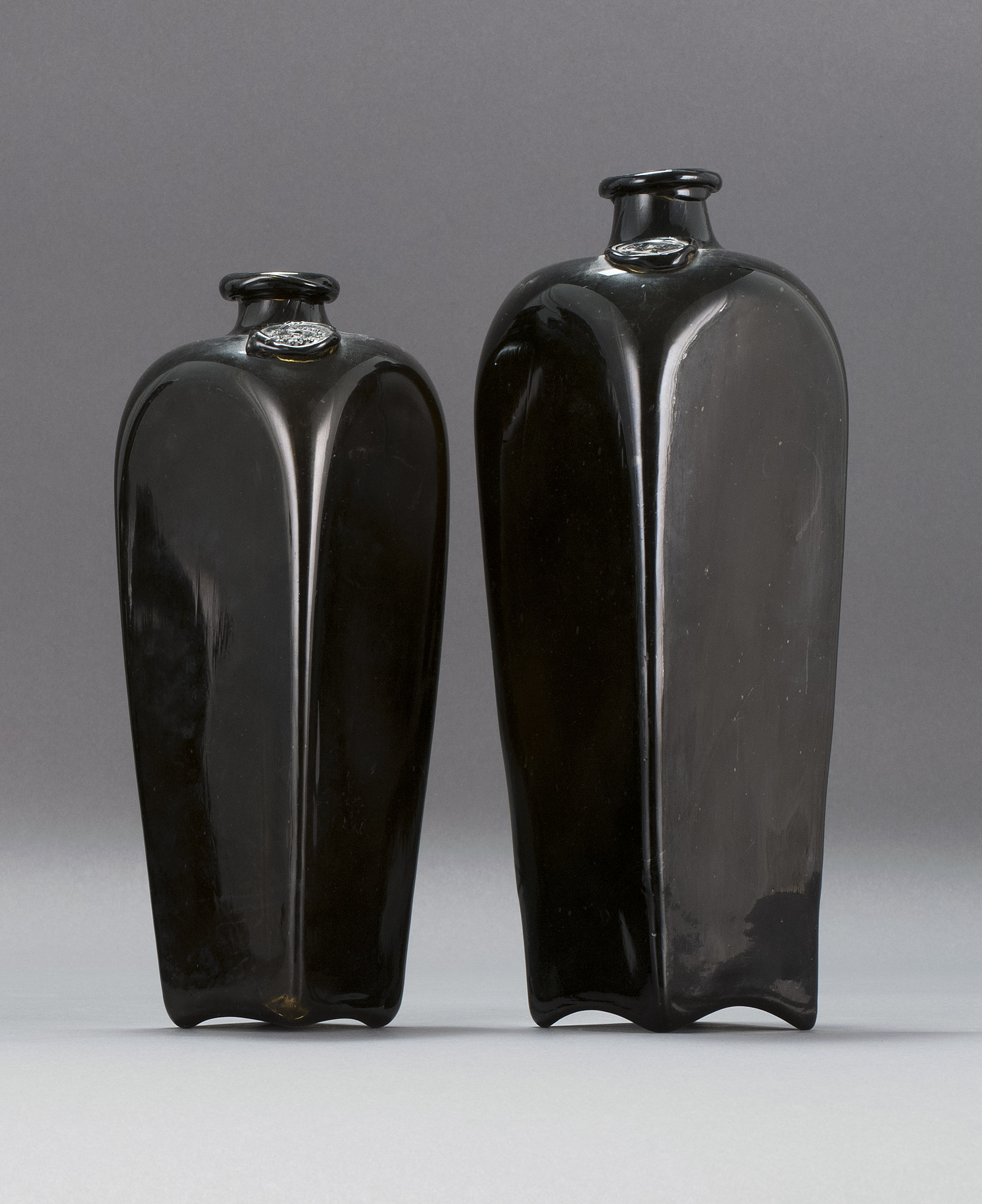 Appraisal: TWO FREE-BLOWN GLASS LIQUOR BOTTLES Late th Early th CenturyIn