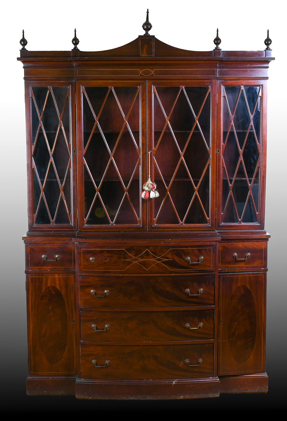 Appraisal: MADDOX COLONIAL REPRODUCTIONS MAHOGANY CHINA HUTCH Surmounting turned finials over