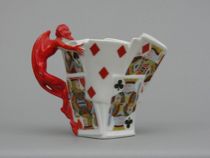 Appraisal: Royal Bayreuth Devil and Cards Pitcher Unique porcelain picture features