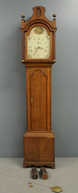 Appraisal: - English oak tall case clock with an enameled dial