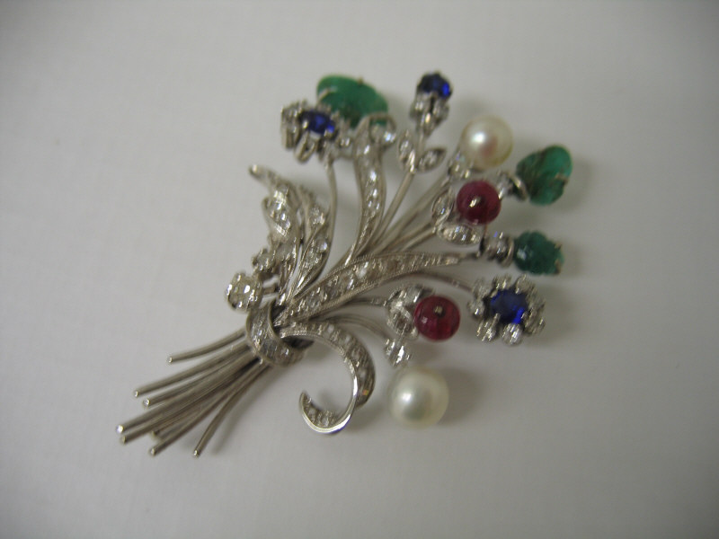 Appraisal: FLORAL BROOCH k white gold gem set brooch set with