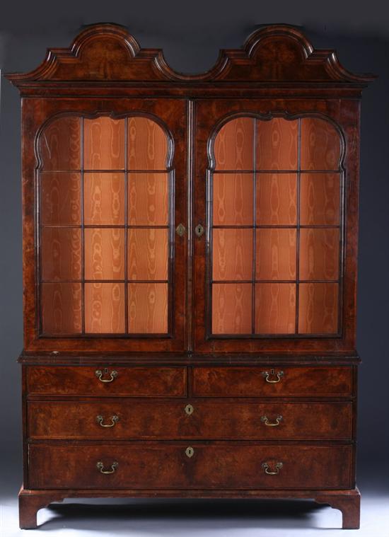 Appraisal: DUTCH BURLED WALNUT STEPPED-BACK CHINA CABINET th century With moire