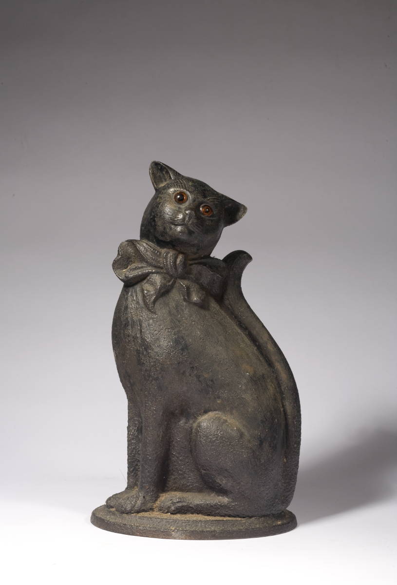 Appraisal: CAST IRON HEARTH ORNAMENT IN THE FORM OF A CAT