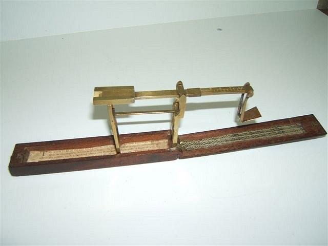 Appraisal: A GEORGIAN BRASS AND MAHOGANY CASED GUINEA SCALE unsigned but