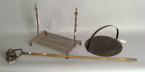 Appraisal: Wrought iron fireplace rack together with a griddle trade sign