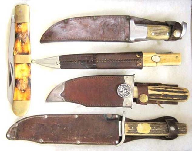 Appraisal: FIVE STAG BONE HANDLE KNIVES IN RIKER TYPE DISPLAY CASE