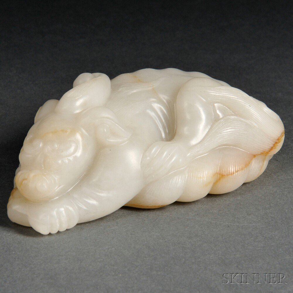 Appraisal: Jade Reclining Bixie China reclining with its front paws beneath