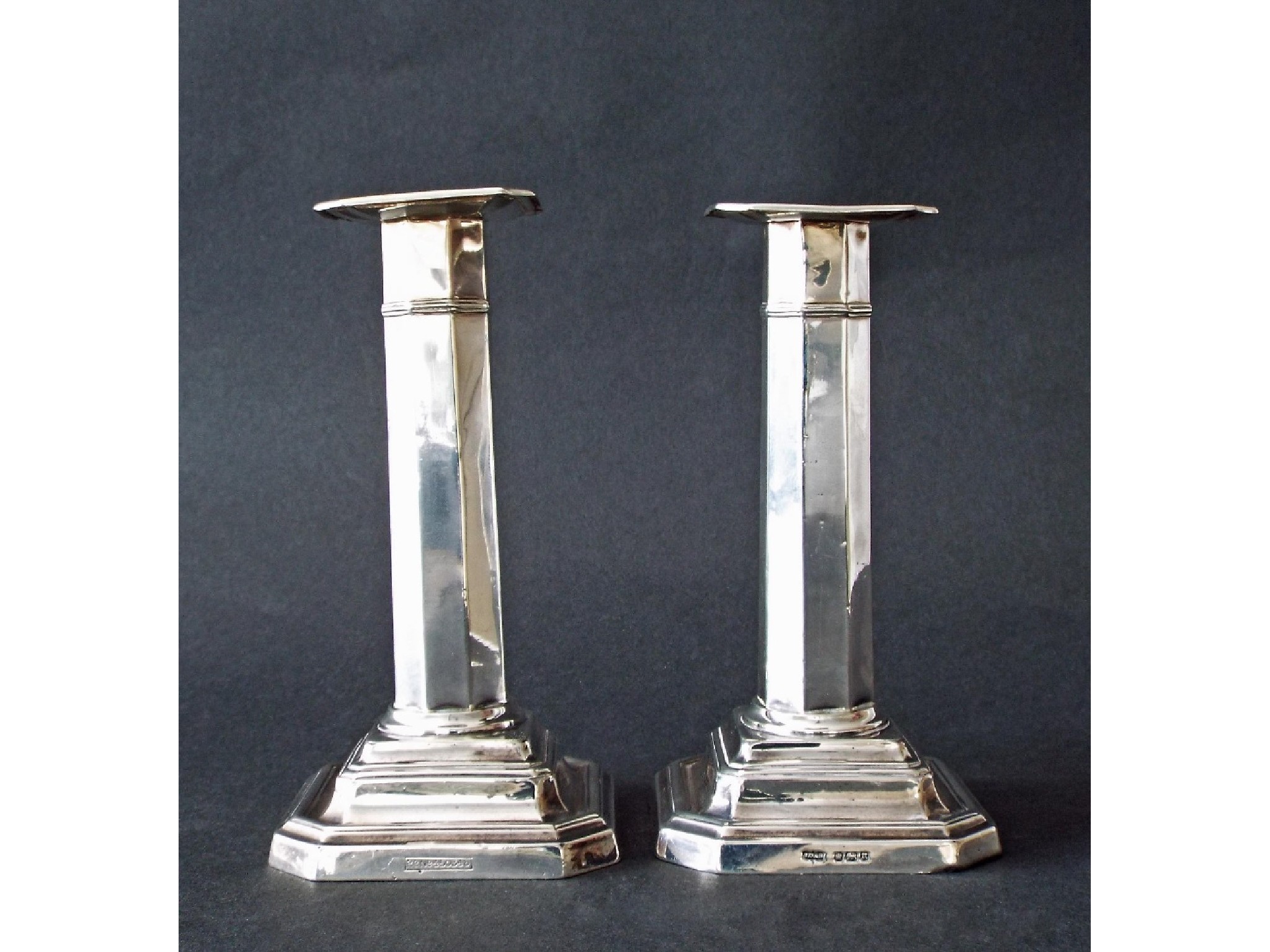 Appraisal: Pair of Edwardian faceted silver candlesticks maker James Dixon Sons