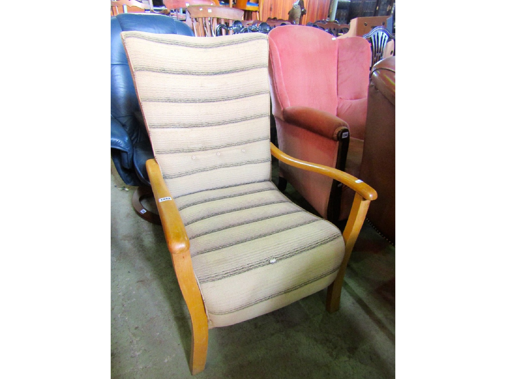 Appraisal: A vintage low light beechwood framed open armchair with striped