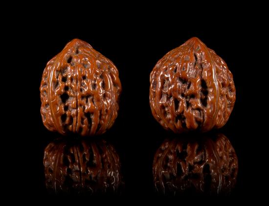 Appraisal: Sale Lot Two Carved Walnuts each of rounded form Length