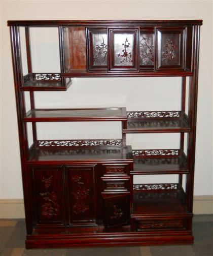 Appraisal: Chinese multi-tiered hardwood display cabinet th century