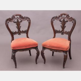 Appraisal: A Pair of Victorian Elaborately Carved Rosewood Side Chairs th