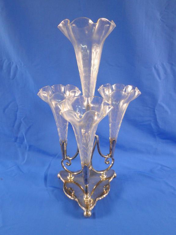 Appraisal: A Victorian cut glass and silver plated epergne with four