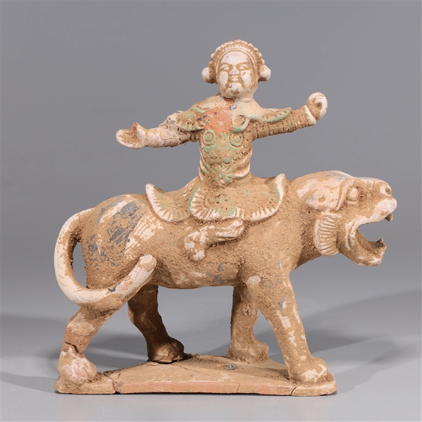 Appraisal: Chinese early style ceramic statue of a beast and rider