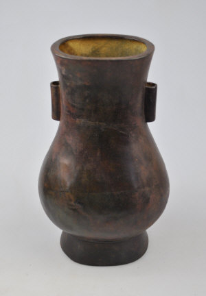 Appraisal: A Chinese bronze vase with tubular handles to the neck