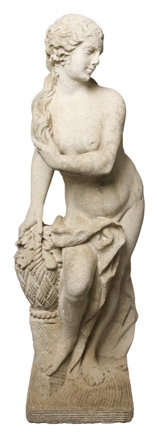 Appraisal: Carved Stone Figure depicting a draped maiden holding flowers raised