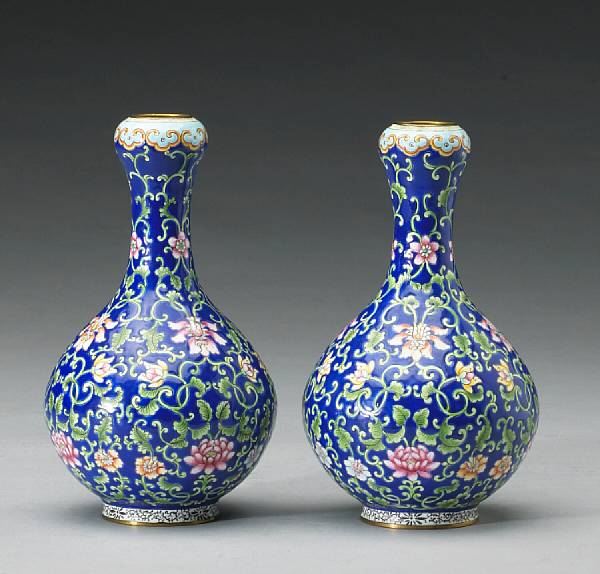 Appraisal: A pair of enameled metal ovoid garlic headed vases Republic