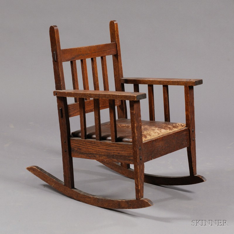 Appraisal: Arts Crafts Child's Rocker Oak and leather United States Four