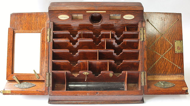 Appraisal: A VICTORIAN OAK DESKTOP TIDY sliding top opening to reveal