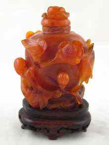 Appraisal: A Chinese hardstone snuff bottle carved in high relief approx