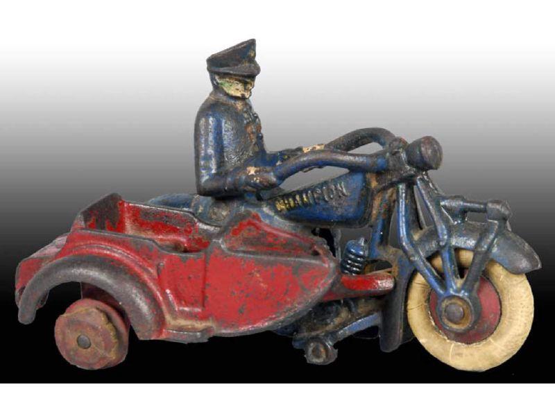 Appraisal: Cast Iron Champion Toy Motorcycle with Sidecar Description Rubber tires