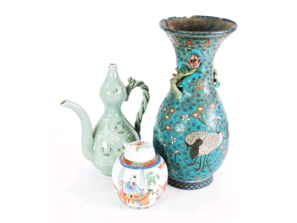 Appraisal: ORIENTAL CELADON GLAZED PORCELAIN GOURD SHAPED WINE POT with entwined