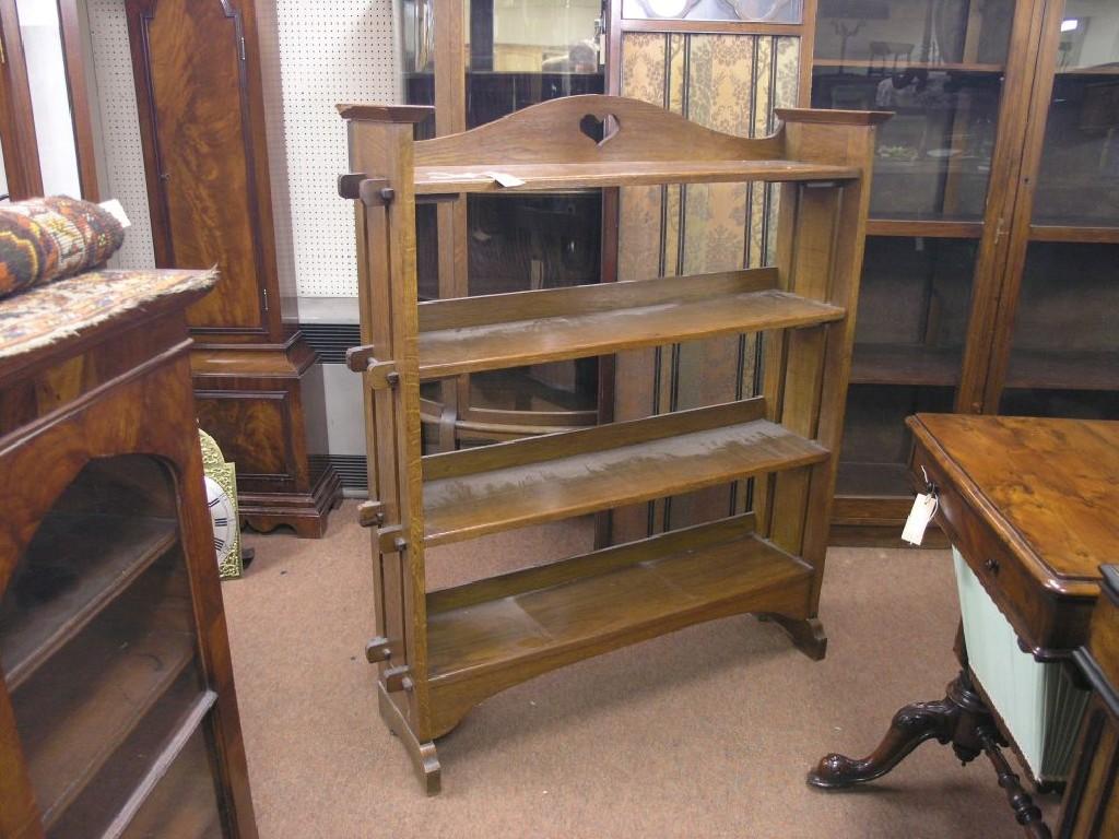 Appraisal: An Art Nouveau solid oak open bookcase four shelves ft