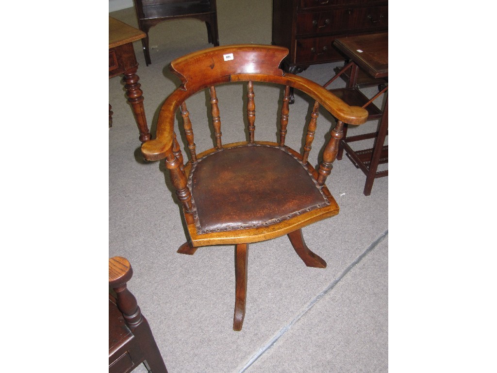 Appraisal: Edwardian oak swivel captains chair