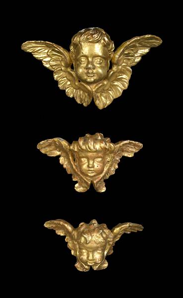 Appraisal: A group of three Italian carved giltwood amorini th th