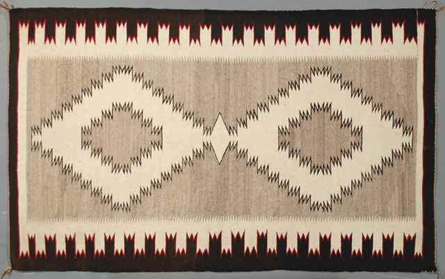 Appraisal: NAVAJO INDIAN AREA RUG hand woven having natural wool ground