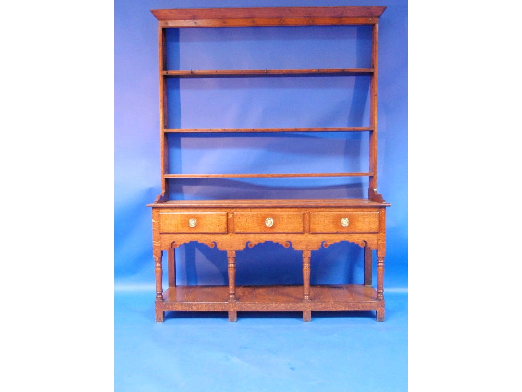 Appraisal: A Georgian oak and pine dresser with open plate rack