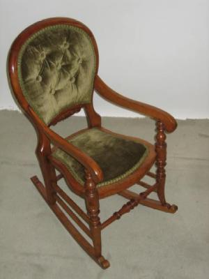 Appraisal: A CHILD'S VICTORIAN BEECH ROCKING CHAIR of spoonback form button