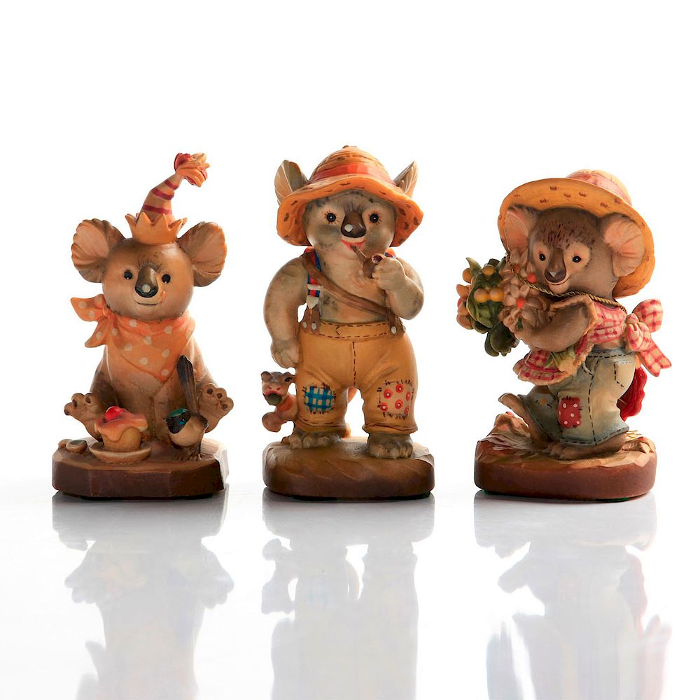 Appraisal: ANRI CARVED WOOD FIGURINES KOALA BEARS Anthropomorphic koala bears Issued