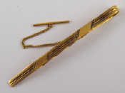 Appraisal: A yellow metal tests carat gold tie clip approx cm