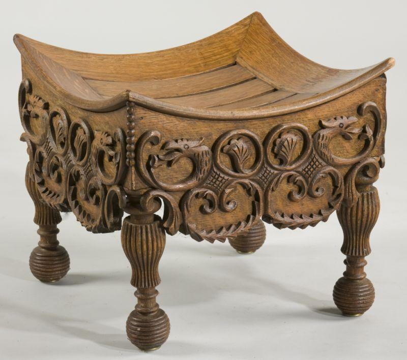 Appraisal: Carved Victorian Oak Footstool sides with deep relief renderings of