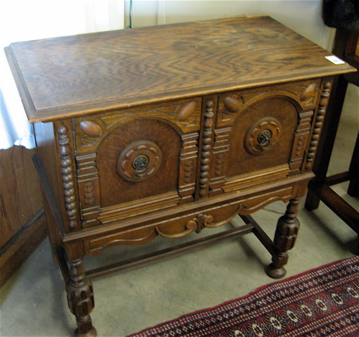 Appraisal: TWO-DOOR OAK SIDE CABINET English Elizabethan Revival style American c