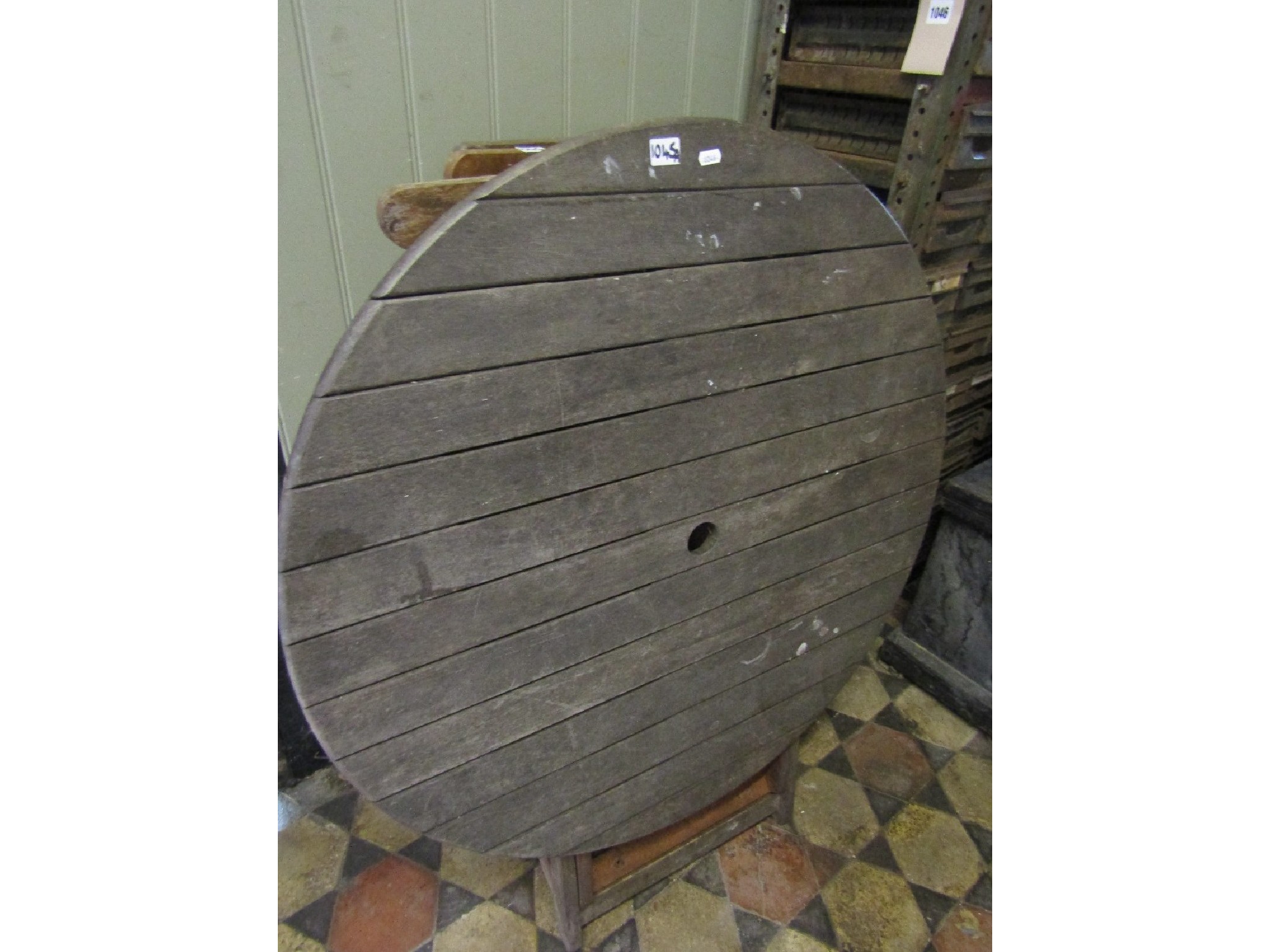 Appraisal: A weathered contemporary hardwood garden terrace table of circular form