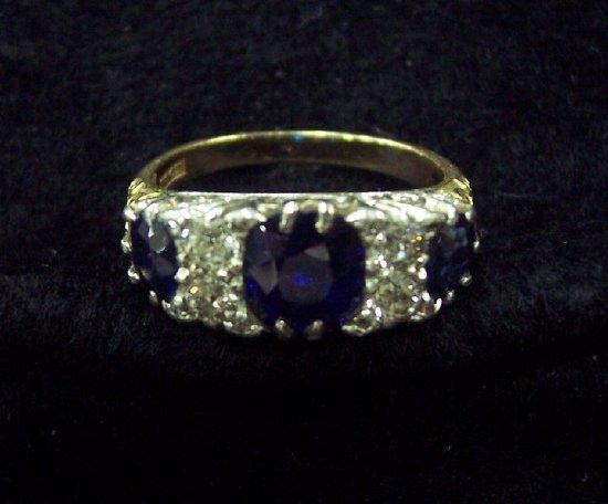 Appraisal: A sapphire and diamond seven-stone ring the three sapphires with