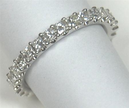 Appraisal: A diamond full-eternity ring claw set with princess cut diamonds