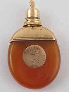 Appraisal: An unusual hardstone perfume bottle with yellow metal tests high