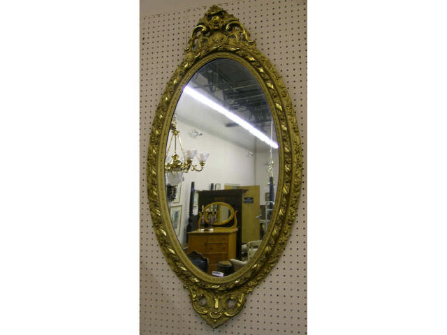 Appraisal: Ornate gold gilt gesso oval wall mirror