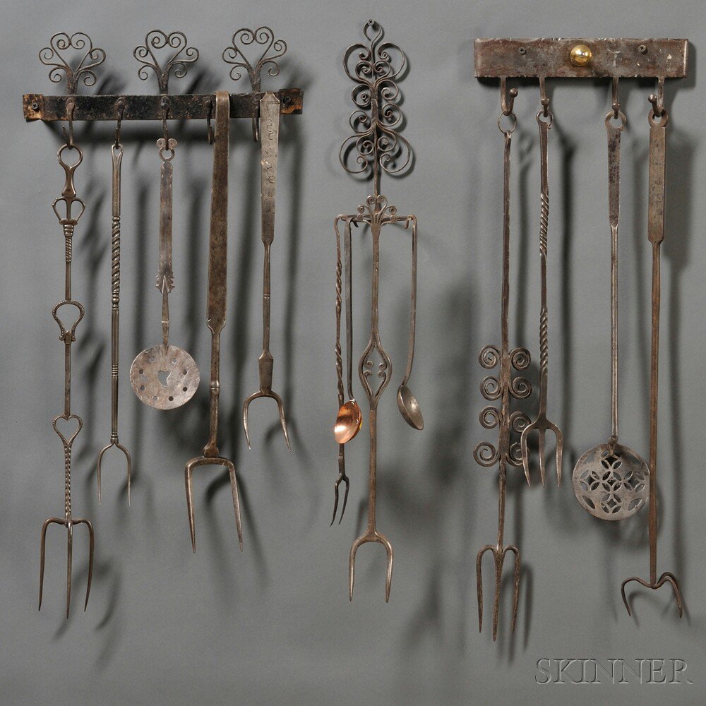 Appraisal: Three Wrought Iron Wall-mounted Racks with Thirteen Wrought Iron Utensils