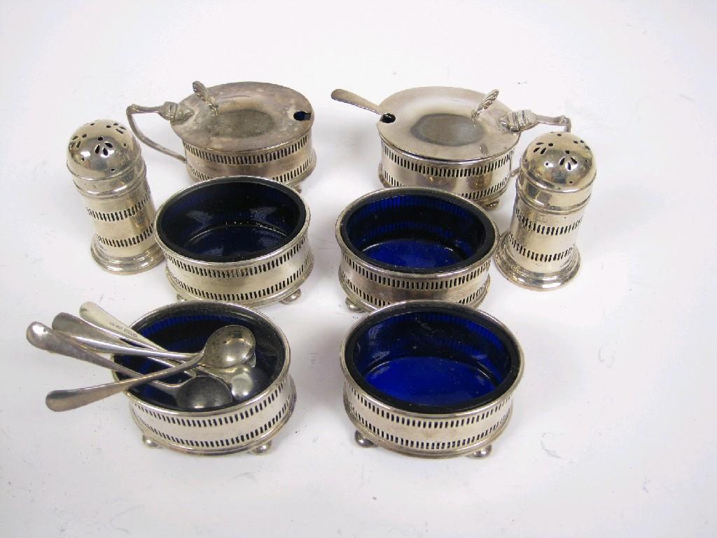 Appraisal: A George V eight piece Condiment Set with pierced friezes