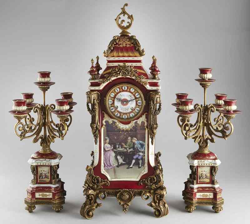 Appraisal: French style ormolu mounted porcelain clockand candelabra set with Vienna