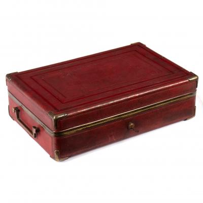 Appraisal: A gentleman's red leather travelling dressing case enclosing a fitted