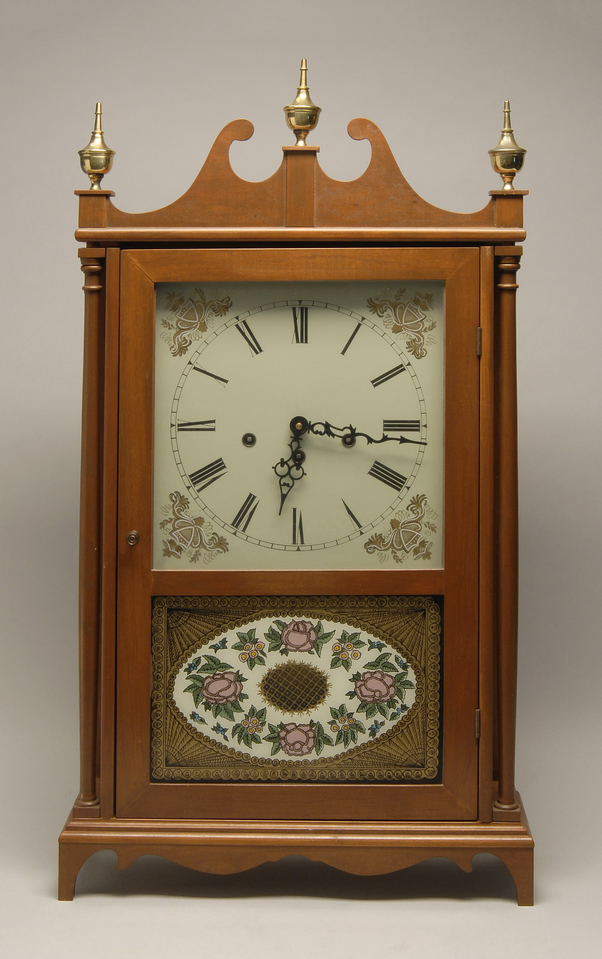 Appraisal: PILLAR SCROLL-STYLE CLOCK th CenturyIn mahogany case Retailed through Mason