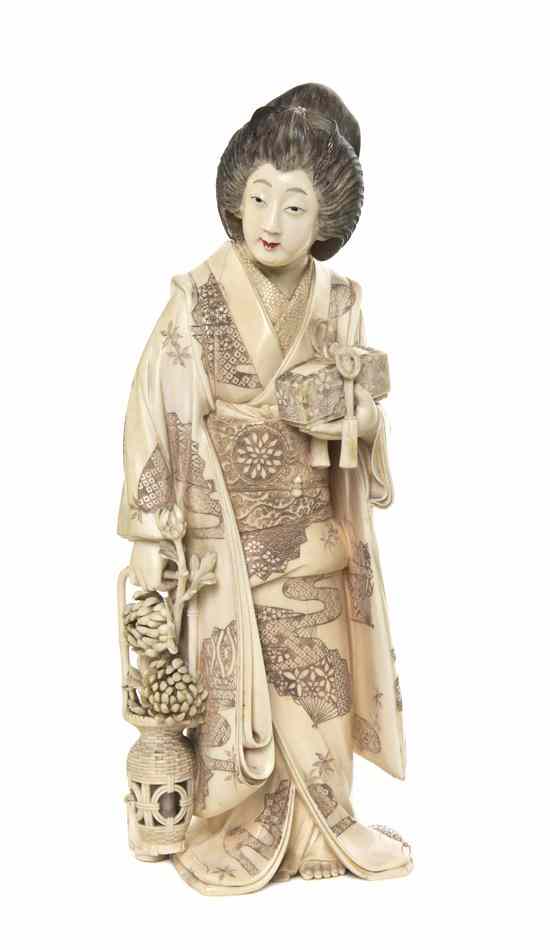 Appraisal: A Japanese Ivory Carving of a Woman depicting the robed